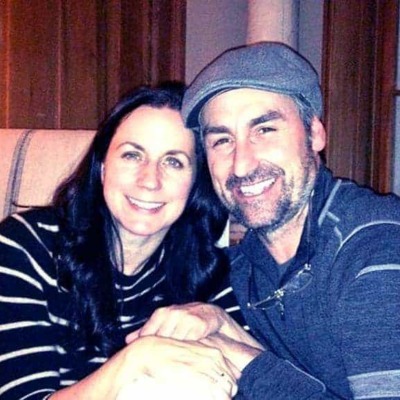 Jodi Faeth and her ex-husband,  Mike Wolfe, holding hands with each other. 